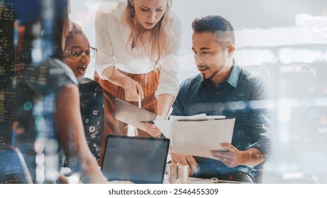 Diverse team collaborating in an office, with a focus on teamwork and technology. Professionals engaged in discussion, sharing ideas and working together. Business teamwork, collaboration concept. - Powered by Shutterstock