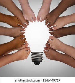 Diversity standing together as diverse people thinking as a team joining feet into the shape of an inspirational light bulb as a community support metaphor or podiatry symbol with 3D elements.