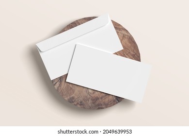 DL Envelope Mockup On Wood With Pastel Background.