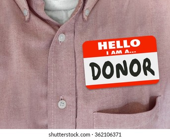 Donor Word On Name Tag On A Red Shirt Worn By A Charitable Person, Philanthropist Or Benefactor