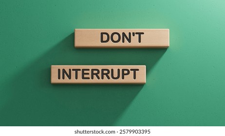 Dont interrupt symbol. Concept word Dont interrupt on wooden blocks. Business and Dont interrupt concept. Copy space.3D rendering on green background.