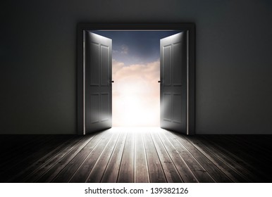 Doors opening to reveal beautiful sky in dark grey room