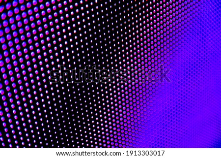 Dotted gradient background with pink, blue and purple tones. for abstract design. Image captured from LED display.