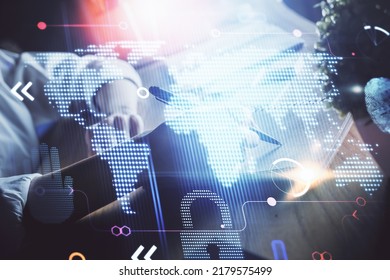 Double exposure of hands making notes with world map hologram and data theme icons. Concept of international network data.