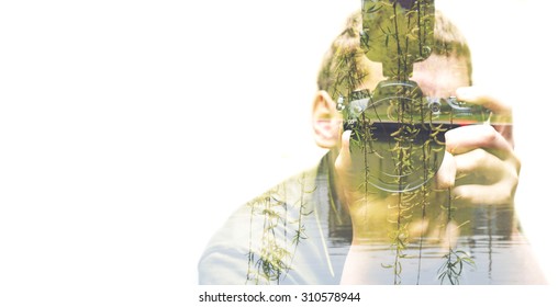 Double Exposure Of The Male Photographer And Nature City Park With River