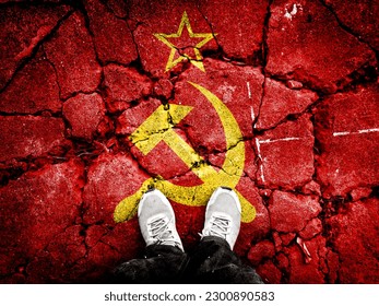 Double exposure of Soviet Union flag with cracks on broken stone. A symbol of the collapse of the Soviet Union is depicted. Footsteps towards disintegration. Useful for basemaps or report descriptions