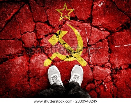 Double exposure of Soviet Union flag with cracks on broken stone. A symbol of the collapse of the Soviet Union is depicted. Footsteps towards disintegration. Useful for basemaps or report descriptions
