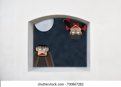 Dracula And Frankenstein With Full Moon On Clerestory Window On White Wall Background