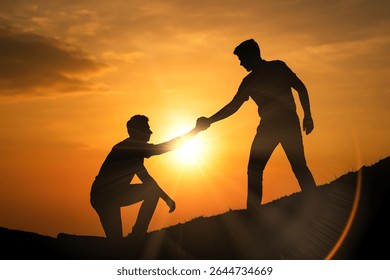 dramatic image of a helping hand being offered to someone climbing, symbolizing trust, partnership, hope, and overcoming challenges together