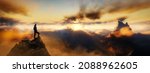 Dramatic View of Adventurous Man standing on top of a rocky peak looking over the Mountain Landscape. 3d Rendering Dream Fantasy Artwork. Colorful Sunrise Sky