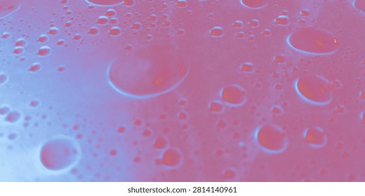 Dreamy Raindrop Reflections
 This intriguing image captures a close-up view of raindrops scattered across a vibrant surface of soft pink and blue hues. Each droplet glistens, reflecting light in distinct patterns that enhance the overall aesthetic. The interplay of colors adds a surreal quality to the scene, creating a dreamy atmosphere. This beautiful arrangement emphasizes the simple yet captivating beauty of water, inviting viewers to marvel at how something so common can become extraordinary through artful presentation.