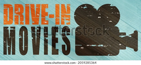 Drive-in movies sign on
wood grain
texture