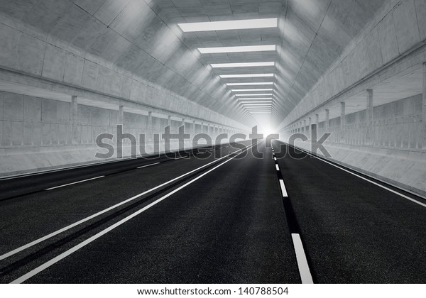 Driving through an underground car\
tunnel. Daylight seeps in through the end of the tunnel. May\
represent travel, speed, transportation or urban\
communication.