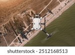 Drone (quadcopter) observer with action camera. Coastal zone control. Flying over the sea and the beach. Background: photo. Drone: 3d model. 3d illustration.