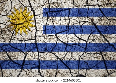 Dry Soil Pattern On The Flag Of Uruguay. Country With Drought Concept. Water Problem. Dry Cracked Earth Country.	