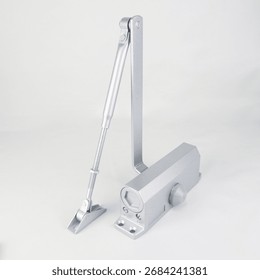 Durable silver automatic door closer with adjustable arm, smooth and safe closing action, easy to install, ideal for home, office, and commercial doors. Modern design with long-lasting performance