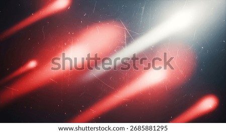Dynamic abstract composition featuring blurred red light trails originating from a bright, luminous light source. The image conveys a sense of movement and energy against a dark, atmospheric backdrop.