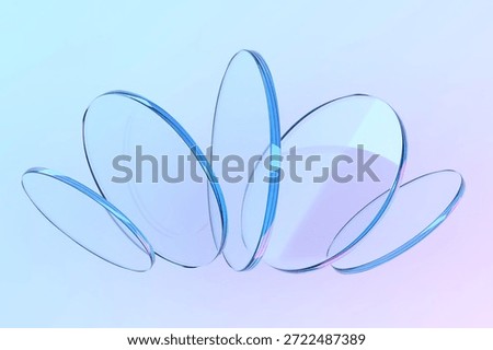 Dynamic abstract composition of floating glass circles on gradient background. 3d render.