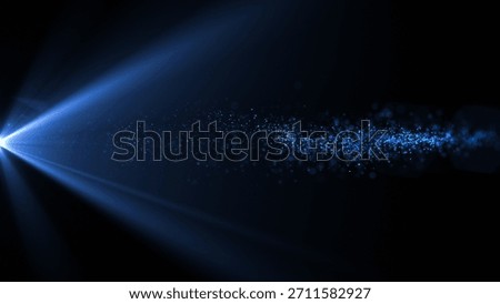 A dynamic blue light beam cuts through a dark background, scattering sparkling particles in its path, creating a futuristic and magical atmosphere.