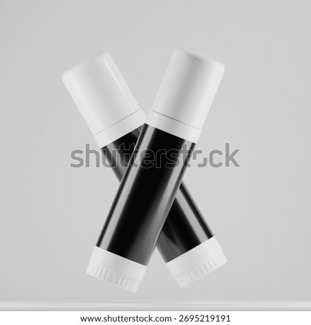 A dynamic, high-quality mockup featuring two floating cosmetic sticks in a criss-cross formation. Ideal for presenting your lip balm, concealer, or deodorant brand in a modern, engaging way. 