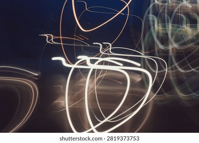 Dynamic light trails loops from car headlights long exposure night drive

