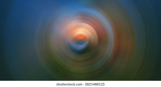 Dynamic radial blur pattern featuring vibrant orange and deep blue light rays. Concentric circles create sense of motion energy in modern abstract artwork.
