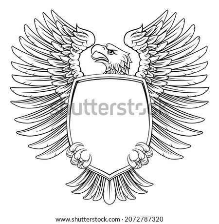 An eagle hawk or flacon shield design element in a vintage engraved woodcut style
