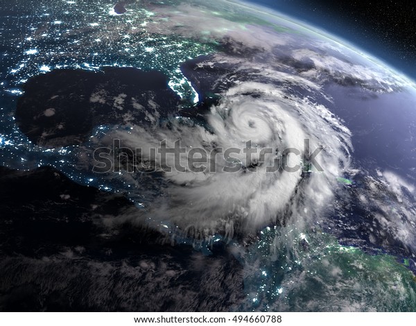 米国フロリダ州近くの街灯と巨大なハリケーンを持つ 夜の軌道から地球