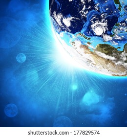 Earth planet in sun rays. Elements of this image are furnished by NASA