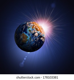 Earth planet in sun rays. Elements of this image are furnished by NASA