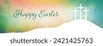 Easter background design of three white crosses on watercolor sunrise background with Happy Easter typography written in blue green, Religious Christian holiday design