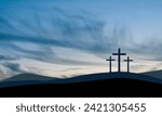 Easter illustration with three crosses on hill and blue sky at dusk.