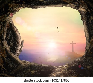 Easter Religious concept: Empty tomb with cross on mountain sunrise background