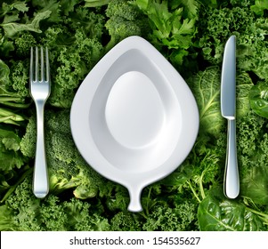 Eating Green Vegetables And Healthy Diet Concept With A Fork Knife And Plate Shaped As A Leaf On A Group Of Dark Leafy Greens As A Symbol Of Natural Nutrition And A Health Based Diet To Fight Cancer.