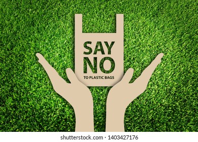 Eco bags. Say no to plastic bags. Paper cut of Eco concept on green grass background. - Powered by Shutterstock