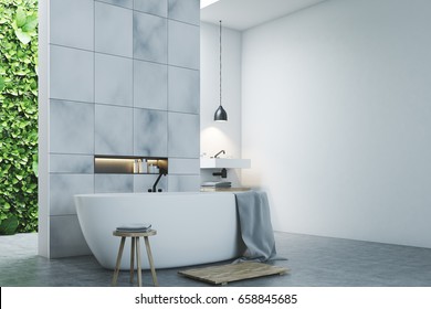 Eco Bathroom Interior With Two Narrow Windows, Green Shrubbery Is Seen Through Them. There Are Two Sinks By The Sides Of A White Tub Standing Near A Marble Tile Wall. Side View. 3d Rendering Mock Up