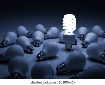 Eco energy saving light bulb , one glowing compact fluorescent lightbulb standing amongst the unlit incandescent bulbs with reflection