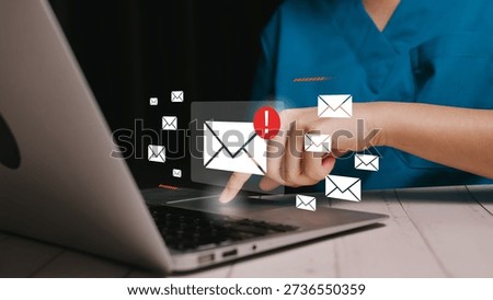 Email notification concept, hand using laptop with incoming message icons, digital communication alert, business correspondence, online information flow