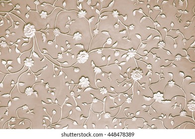 The Embossed Pattern Of Flowers And Leaves On A Beige Background