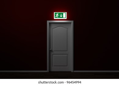 Emergency Exit With Glowing Sign Over Door In A Room