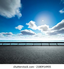 Empty Asphalt Highway And Blue Sea Nature Landscape At Sunset 3d Rendering