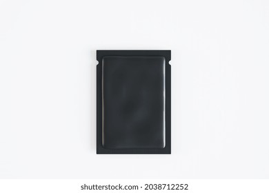 Empty Black Product Packet On White Background. Mock Up, 3D Rendering