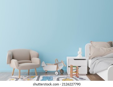 Empty Blue Wall In Modern Child Room. Mock Up Interior In Contemporary Style. Free Space, Copy Space For Your Picture, Text, Or Another Design. Bed, Armchair, Toys. Cozy Room For Kids. 3D Rendering