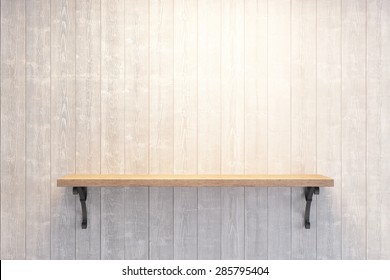 Empty Book Shelf On Wooden Wall