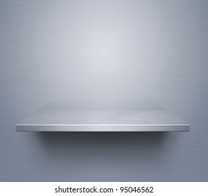 Empty Brushed Metal Shelf At The Wall