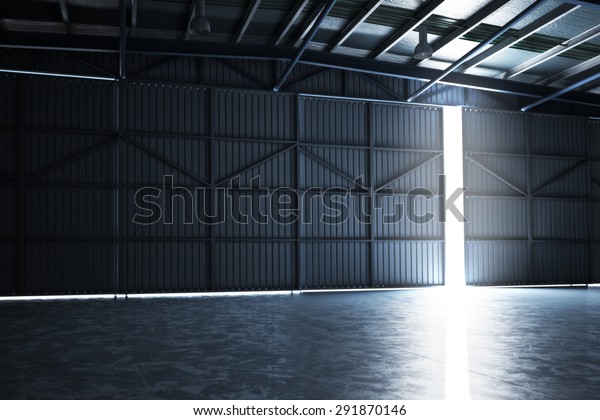 Empty
building hangar with the door cracked open with room for text or
copy space. Photo realistic 3d interior
render