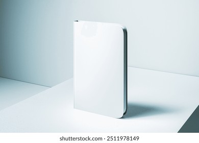 Empty closed white notebook with mock up place on light desk and concrete wall background background. Back to school, education and supplies concept. 3D Rendering