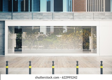 Empty glass shopfront in daylight. Advertisement concept. Mock up, 3D Rendering
