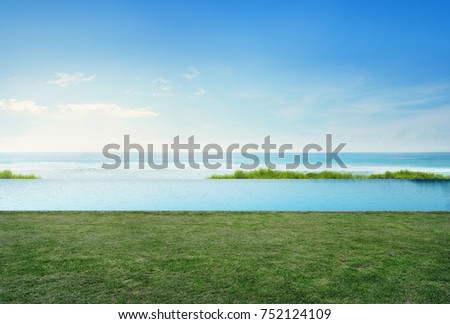 Empty grass floor deck in luxury beach house with blue sky background, Sea view terrace at vacation home or hotel, Photo and 3d rendering of swimming pool combined