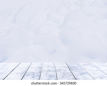 Empty Ice Wooden Deck Table Top Ready For Product Display Montage With Snow Forest  In Mountain Background.